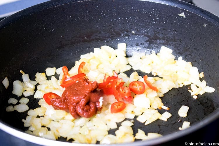 Onions and chilli frying in pan | Jollof rice recipe