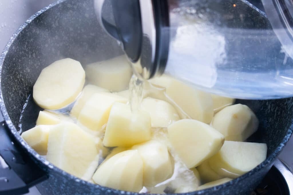 boiling water on potatoes