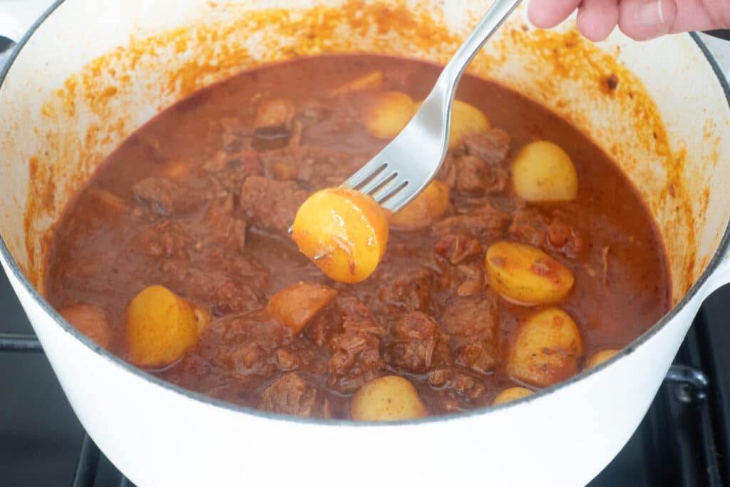 fork tender potatoes in stew