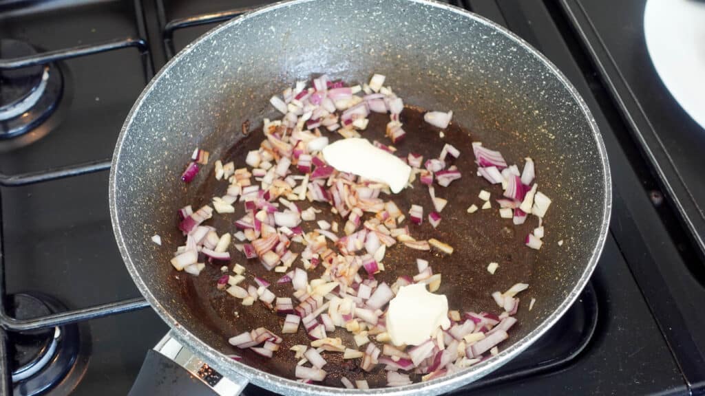 Onions and garlic with butter in a pan