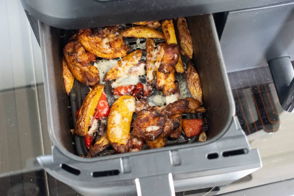 cooked nandos chips with chicken in the air fryer with cheese