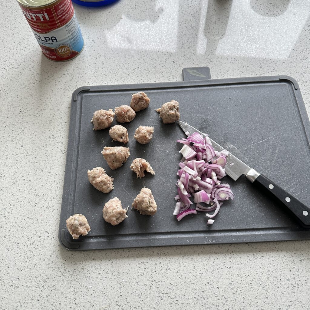 finely chopped onion and sausage meat