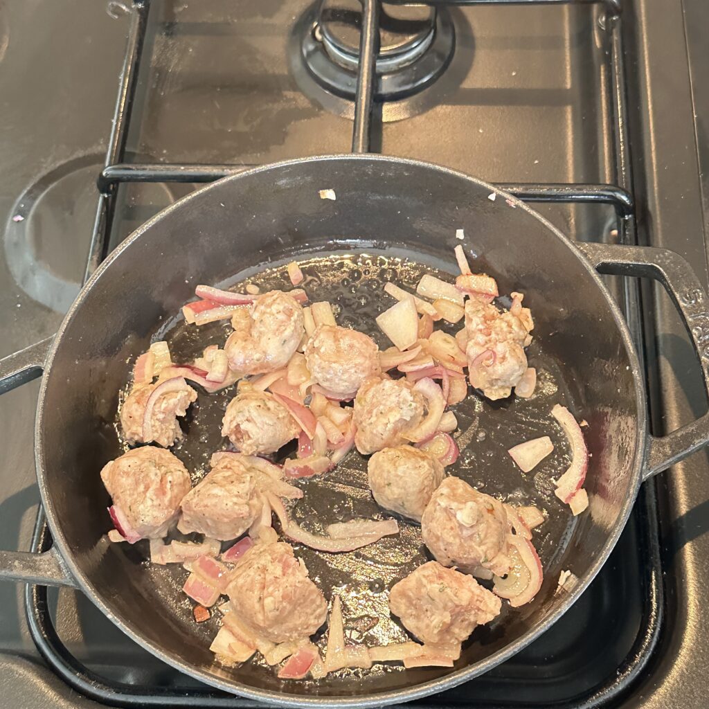 cooking sausage and onion in butter