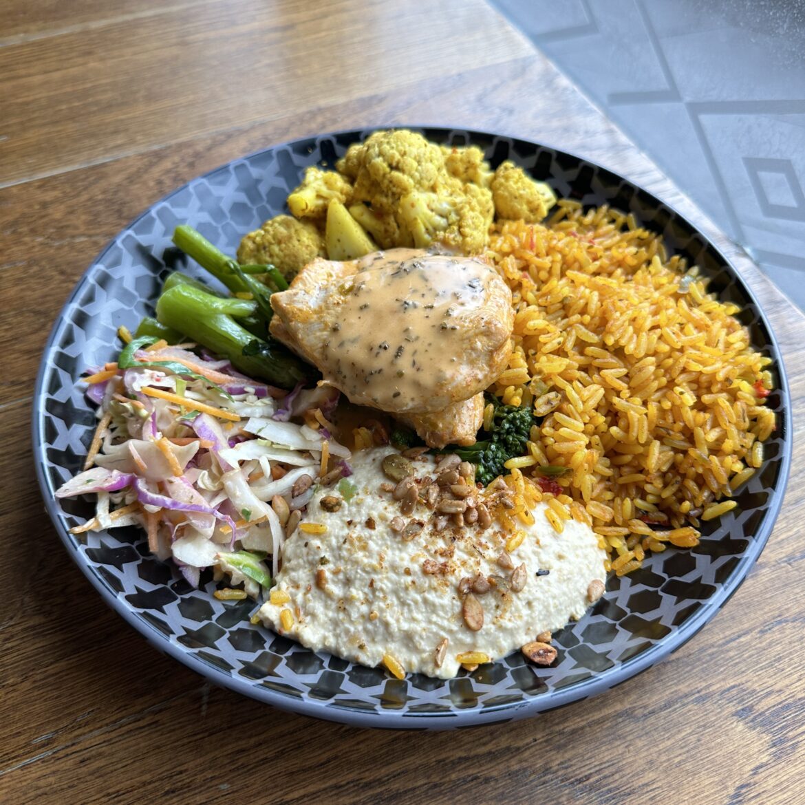 Nandos spicy rice bowl with sauce and chicken breast