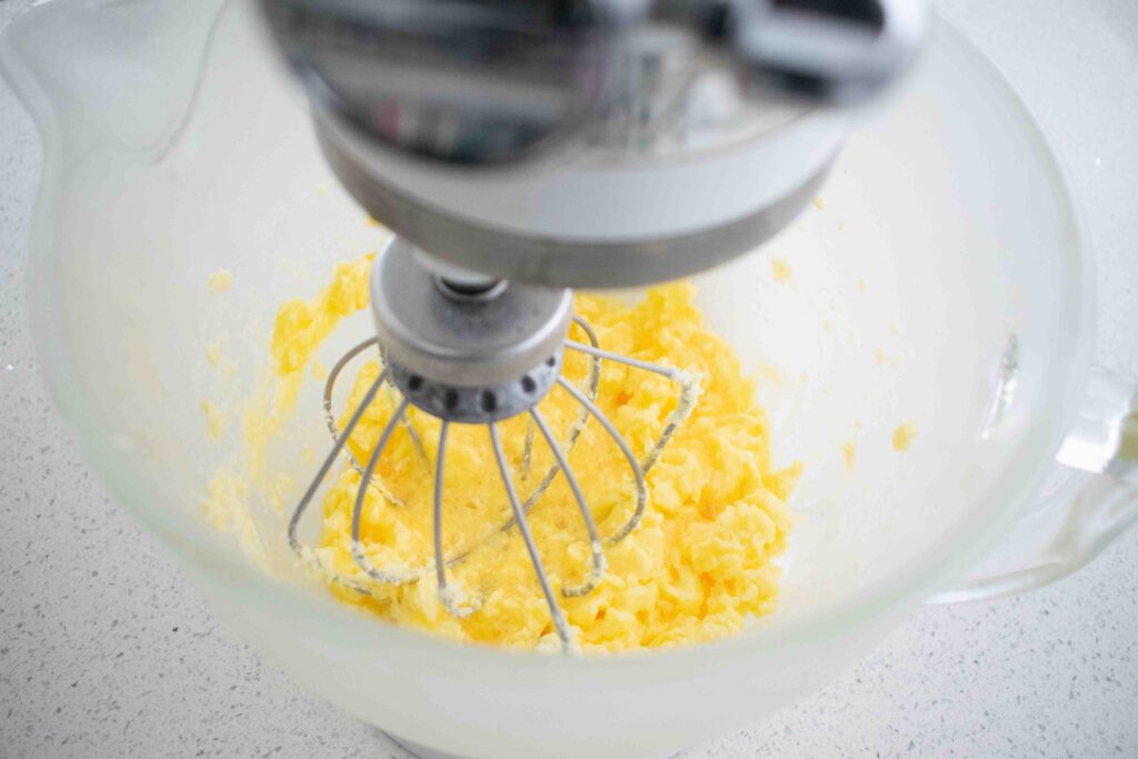 mixing batter for a cherry coconut cake