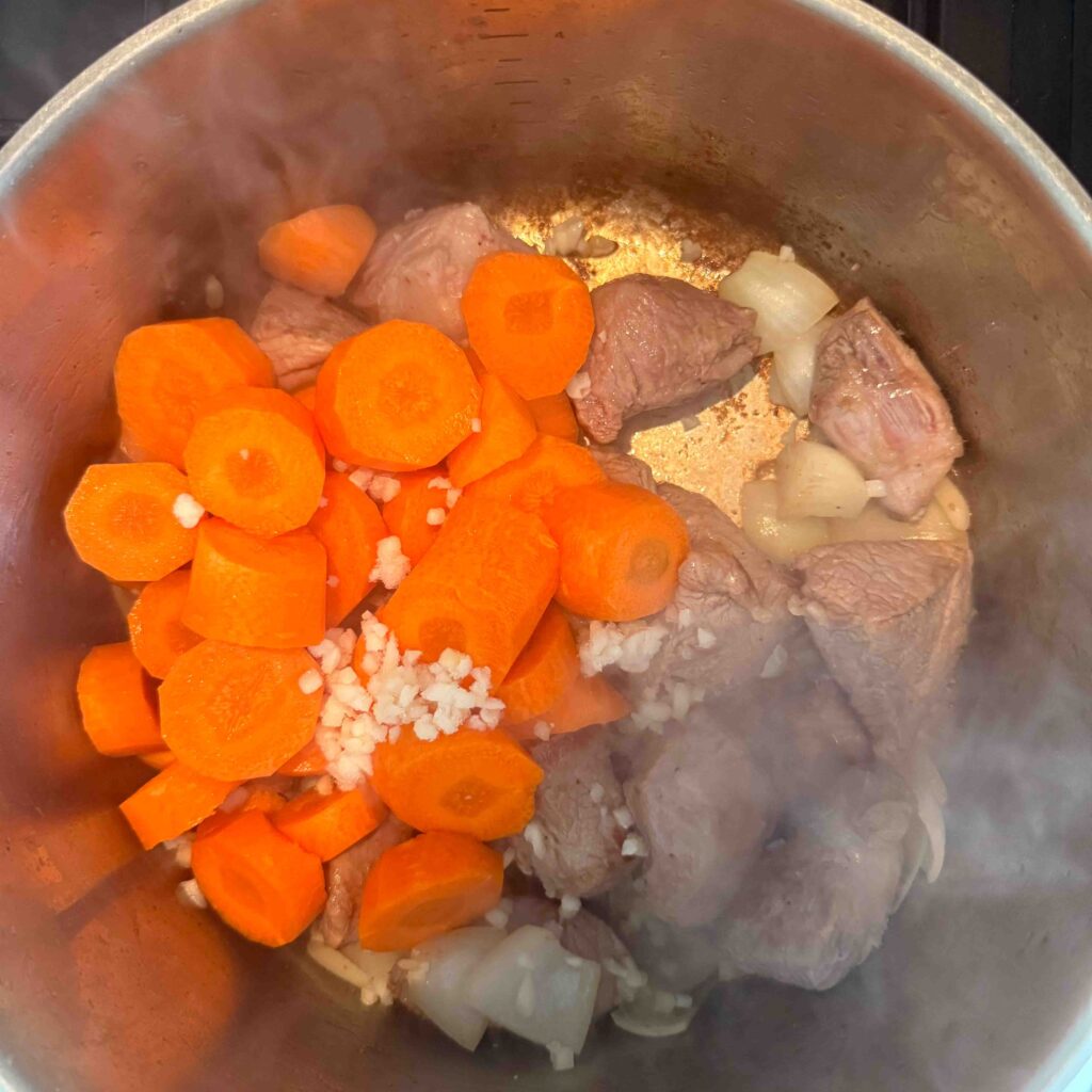 adding onions garlic carrot