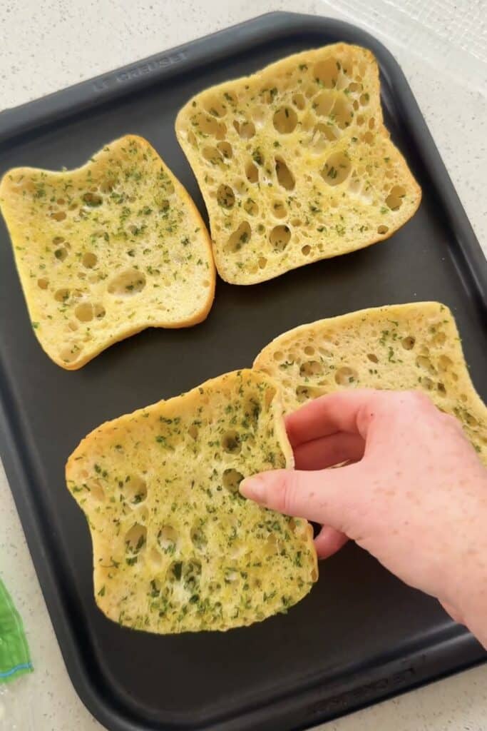 garlic ciabatta squares on baking tray